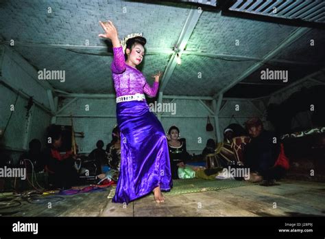 A young woman performing jaipong, a traditional Sundanese dance, on ...