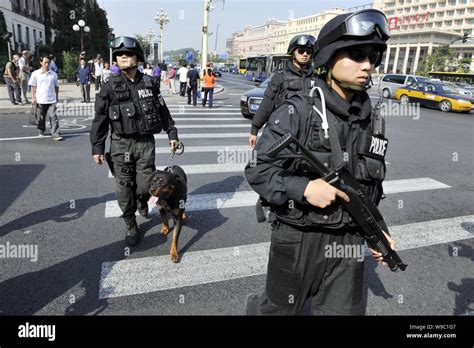 Chinese special policemen and their police dogs patrol the ChangAn ...