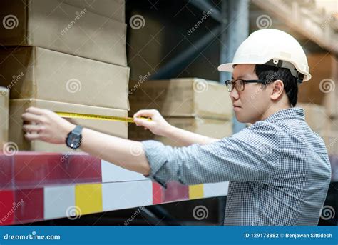 Worker Hand Using Tape Measure On Cardboard Box Stock Photo Image Of