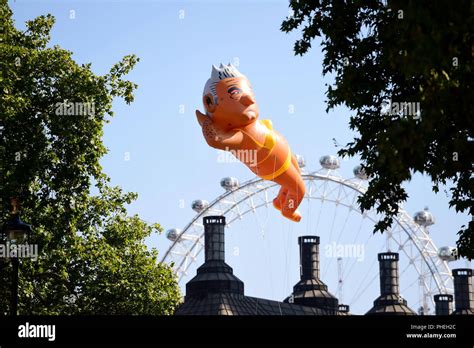 An Inflated Blimp Of London Mayor Sadiq Khan Depicted In A Bikini Flies