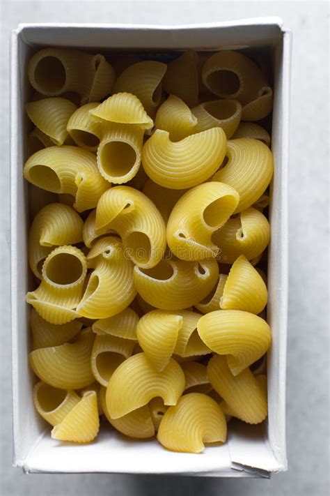 Flat Lay Of Uncooked Pipe Rigate Pasta In A Box Top View Of Pipe