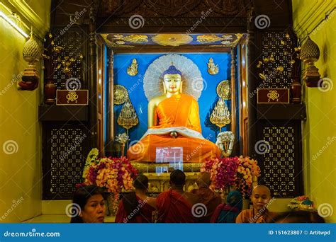 Indian Buddhist Monk And People Standing And Praying On Bare Foot In