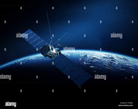 Communications Satellite Orbiting Earth With Sunrise In Space Stock