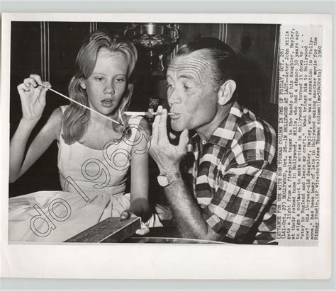 Hollywood Actor John Mills Gets A Light From Daughter Hayley 1960 Press