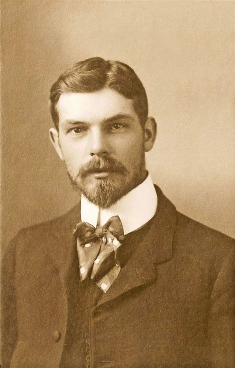 An Old Black And White Photo Of A Man With A Beard