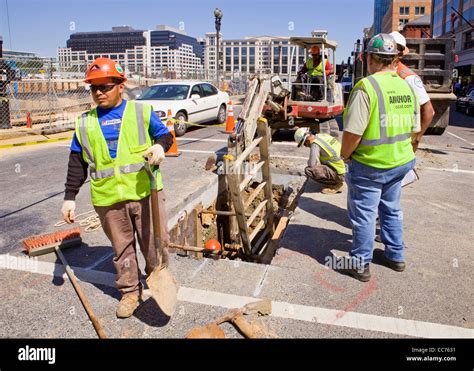 Municipal Construction Workers Digging In City Street Washington Dc