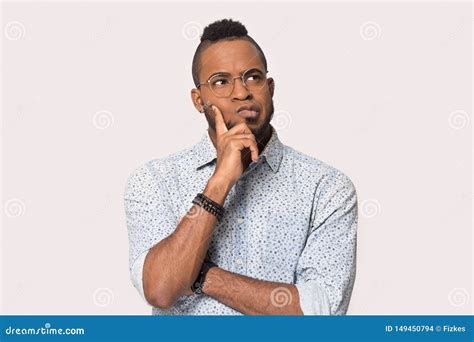 Pensive Black Male In Glasses Isolated On Grey Background Thinking