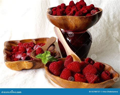 Fresh Frozen Dehydrated Raspberry In Wooden Bowl And Raspberry Jam In