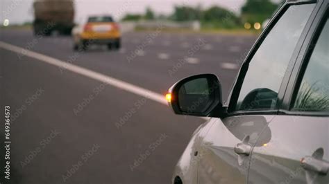 Close Up Of Car On Side Of Highway With Indicator Lights On Showing