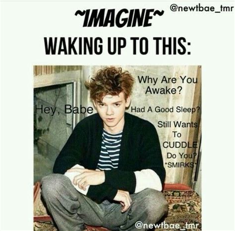 A Man Sitting On Top Of A Couch In Front Of A Poster That Reads Imagine Waking Up To This Why