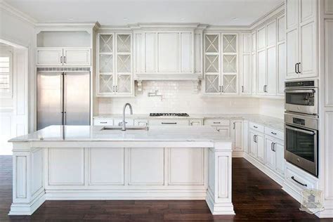 Stunning Kitchen Features Glazed White Cabinets Adorned With Oil Rubbed