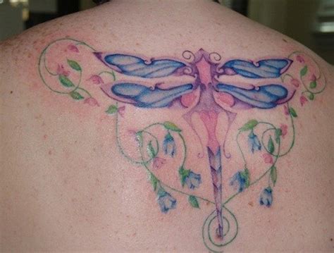 Blue dragonfly tattoo on back - Tattooimages.biz