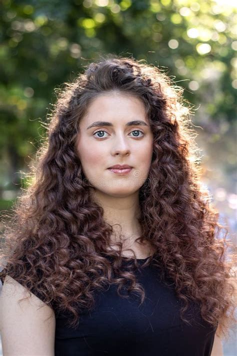Brunette With Long Curly Hair In Nature Beautiful Model Woman With