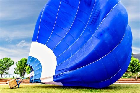 Premium Photo Colorful Hot Air Balloon Flying Over Blue Sky With White Clouds