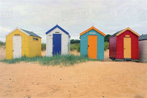 Front View Of A Row Four Multi Coloured Beach Huts Southwold Suffolk