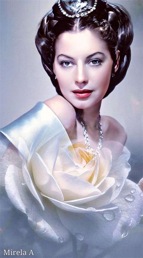 A Woman Wearing A Tiara With A White Rose In Her Hair And Pearls Around