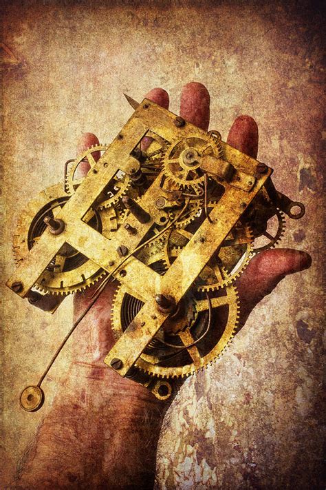 Hand Holding Clock Gears By Garry Gay
