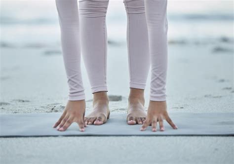 Premium Photo Low Section Of Person Standing On Beach