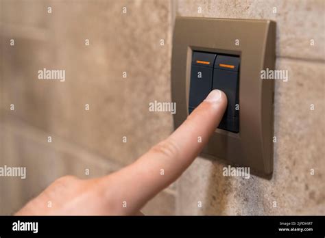 Female Person Hand Switches Off Light Adult Woman Presses Light Button To Turn Off Light In