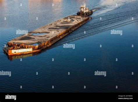 Tugboat Pushing Barge With Sand Stock Photo Alamy