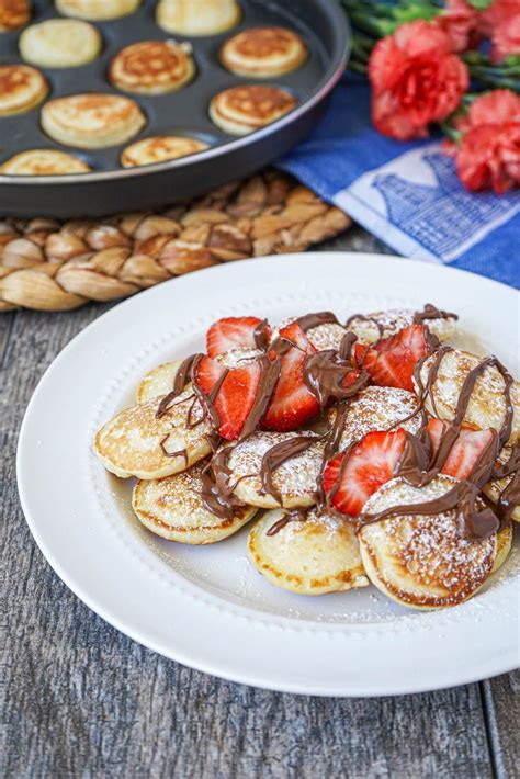 Poffertjes Dutch Mini Pancakes Topped With Fresh Strawberries And