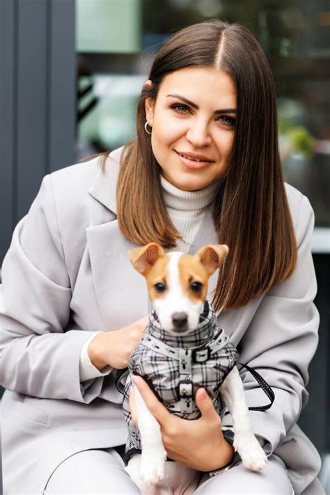 Woman In Casual Jacket Hugging Her Favorite Fluffy Trained Purebred