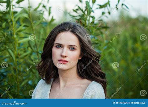 Pretty Healthy Young Brunette Woman With Fresh Clear Skin And Long Dark