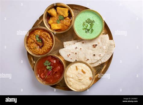 Indian Hindu Veg Thali / food platter, selective focus isolated on white background Stock Photo ...