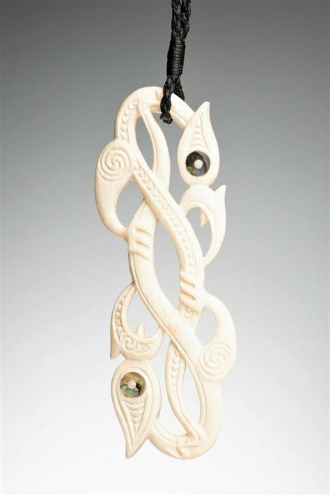 Whale Bone Carving Stylised Double Manaia with Kowhaiwhai