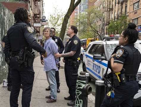 nypd arrests artist painting message  support  unhoused man