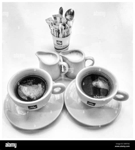 Black And White Photo Of Two Cups Of Coffee Stock Photo Alamy