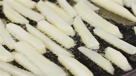 Frying Potato Strips Into A Hot Pan With Oilin Close Up French Fries Potato Wedges Are Fried