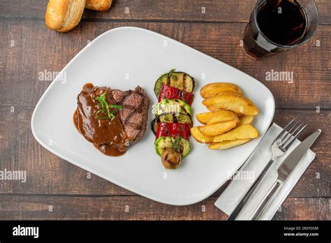 Grilled beef tenderloin with Demi glace sauce with grilled vegetables ...
