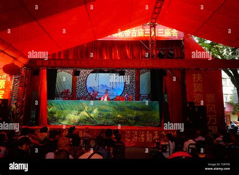 Shenzhen China People Watch A Traditional Puppet Show At The