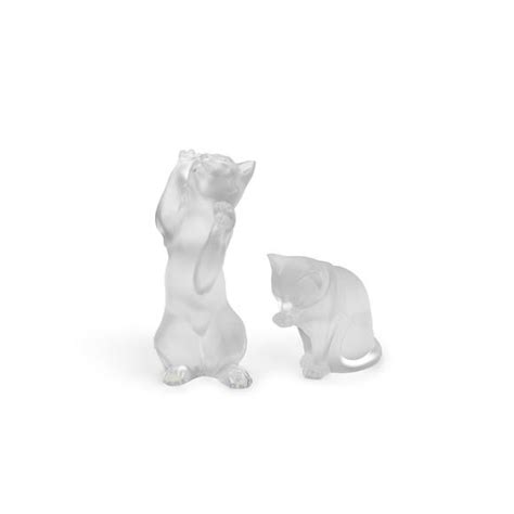 Bonhams A Lalique Molded Frosted Glass Playing Cat And A Seated Cat Cleaning A Paw Late 20th