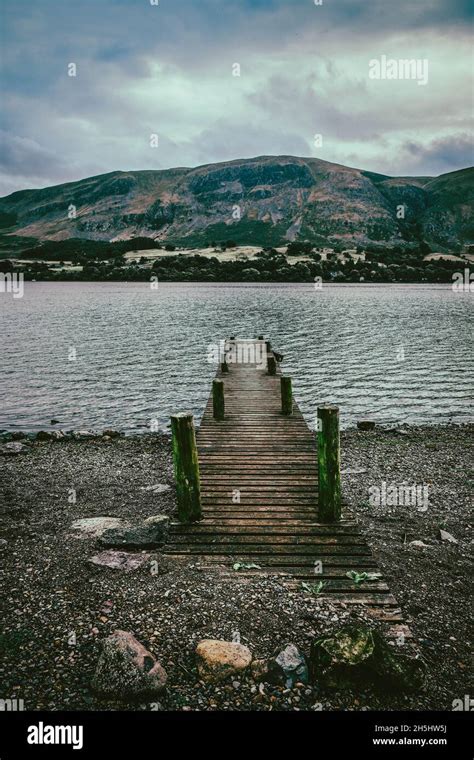 A Pier Runs In To Ullswater Lake In The Lake District In Cumbria