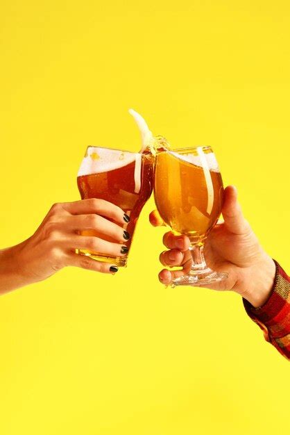 Premium Photo Couple Toasts With Glasses Of Cold Beer Two Hands