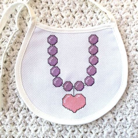 This Purple Bead Necklace With A Pink Heart Baby Bib Is A Digital