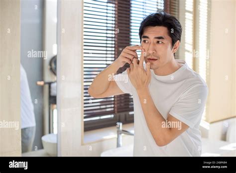 Mature Man Popping Pimple On His Face Stock Photo Alamy