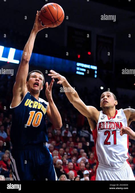 UC Irvine guard Luke Nelson (10) shoots over Arizona forward Brandon Ashley (21) during the ...