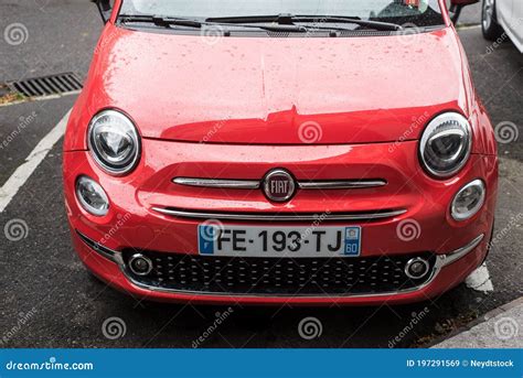 Front View Of Corail Color Fiat 500 Parked In The Street By Rainy Day Editorial Stock Image