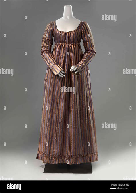 Ankle Length Gown With A Ruffled Edge In The Early Years Of The Th