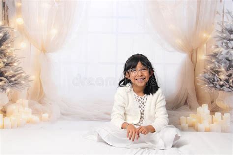 Year Old Latina Girl With Eyeglasses Among Decorated Trees Is Excited To Celebrate Christmas