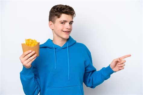 Premium Photo Teenager Russian Man Holding Fried Potatoes Isolated On