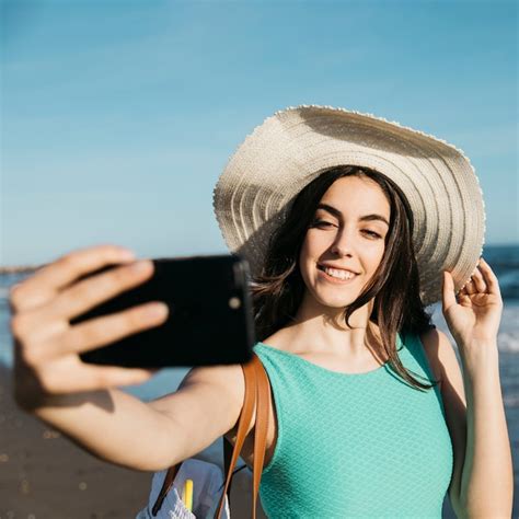 Free Photo Stylish Woman Taking Selfie At The Beach