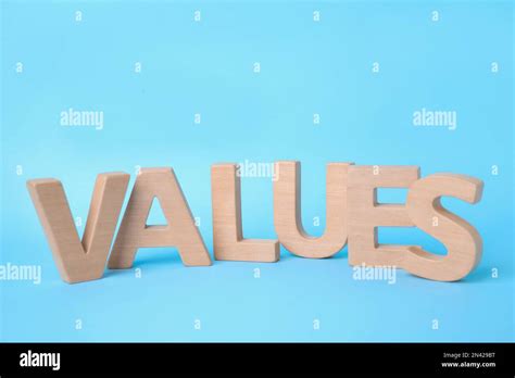 Word Values Made Of Wooden Letters On Light Blue Background Stock Photo