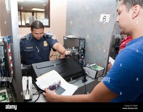 Us Customs And Border Protection Officer Uses Scanner To Document And