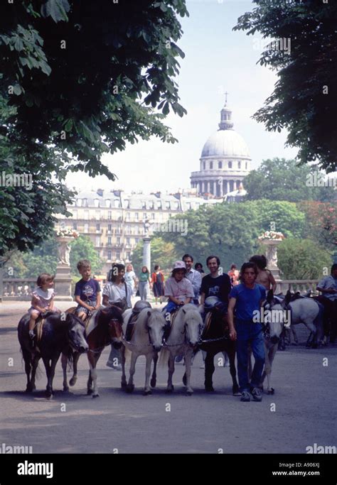 Paris, Luxembourg Gardens and Pantheon. Children on ponies Stock Photo ...