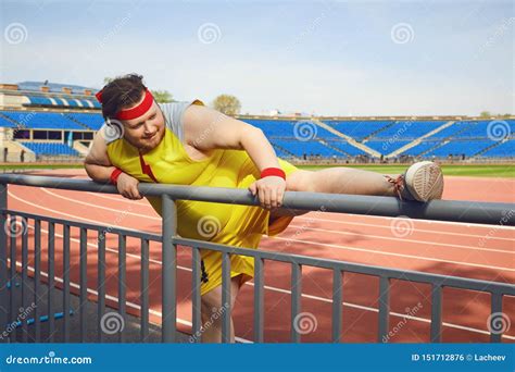 Fat Funny Man Doing Stretching at the Stadium Stock Photo - Image of ...