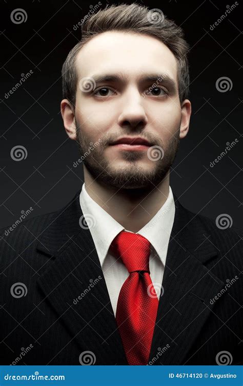 Portrait Of Young Handsome Man Businessman In Black Suit Stock Photo